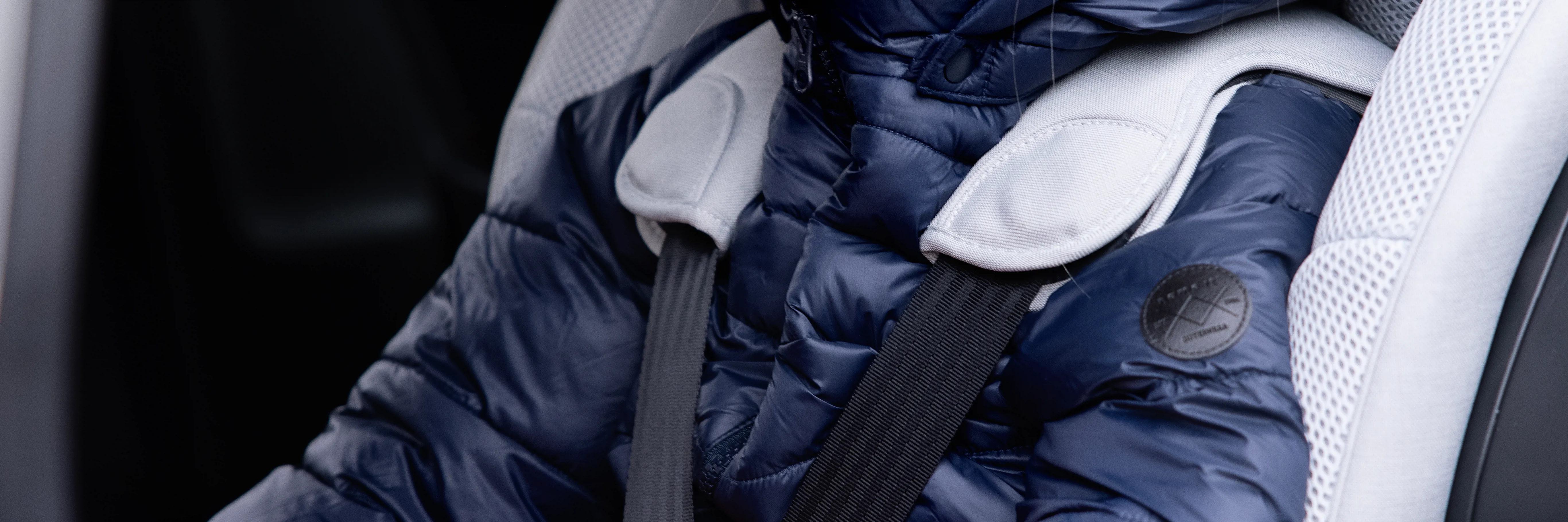 Which parts of a child car seat can be added or removed?